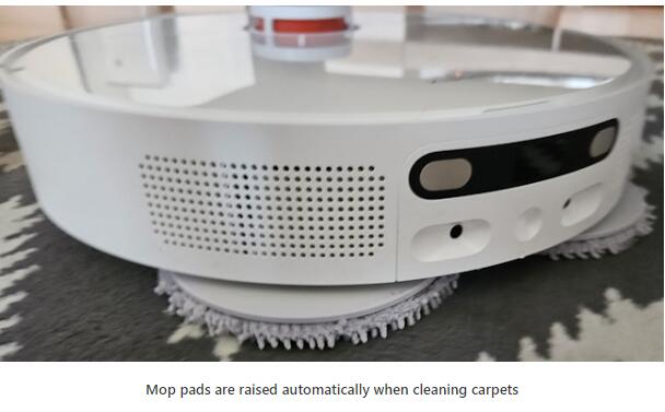 Mop pads are raised automatically when cleaning carpets