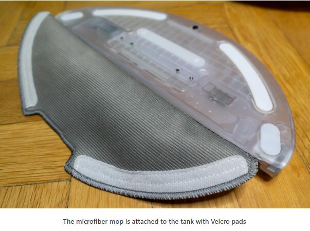 The microfiber mop is attached to the tank with Velcro pads