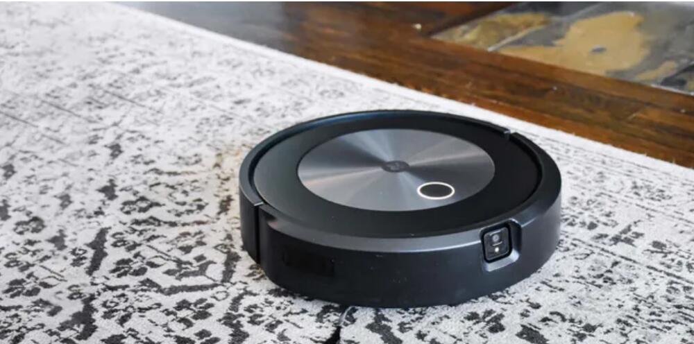 iRobot Roomba j7+ with light on