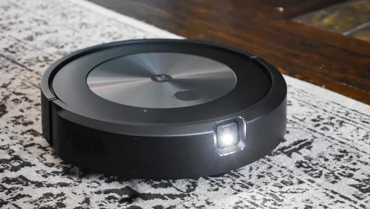iRobot Roomba j7+ with light on